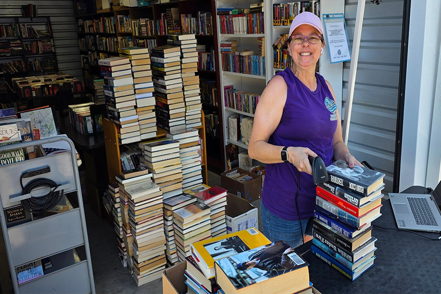 Shelves full of books and media inside the store